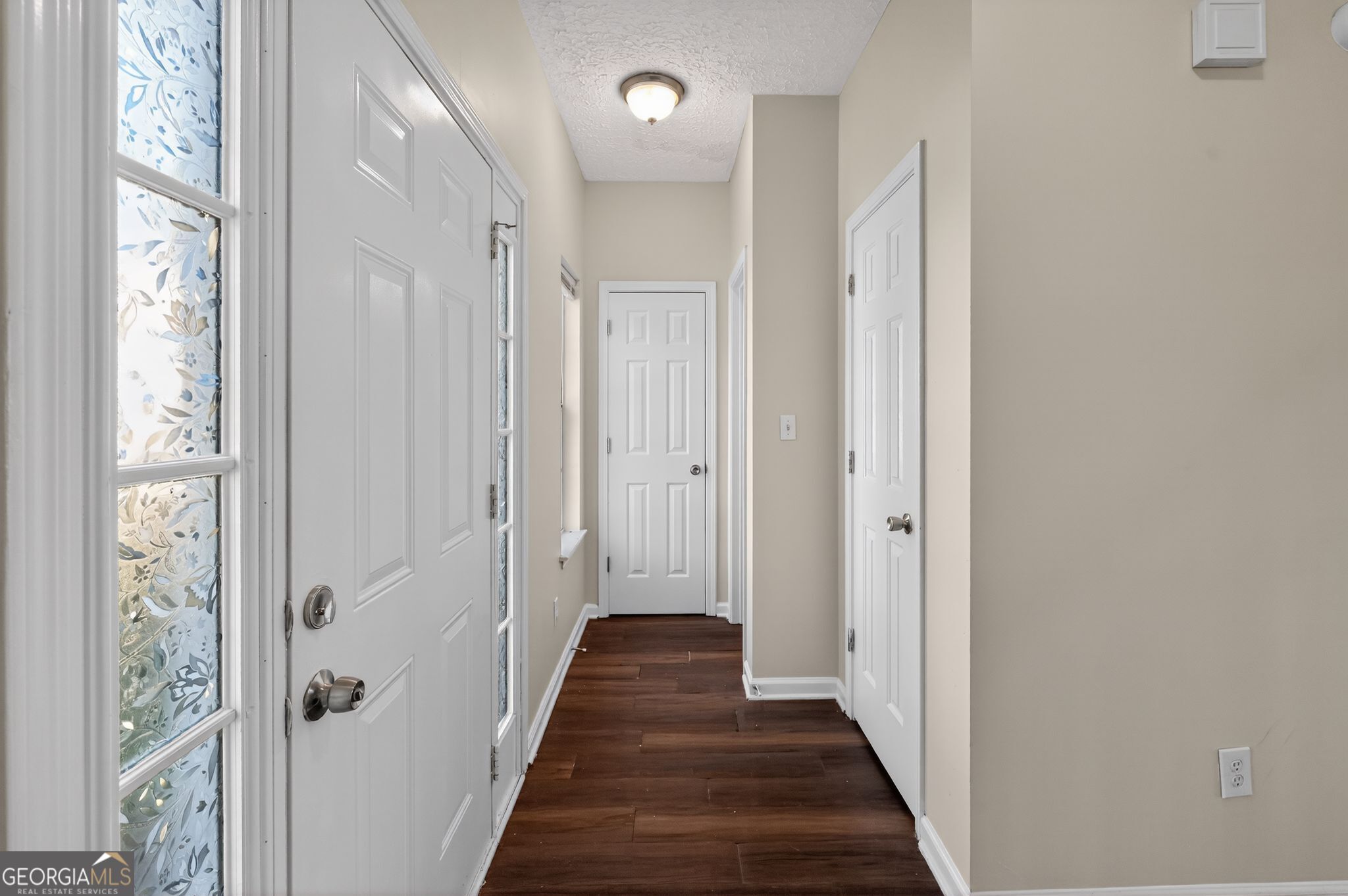 4292 Linecrest Lane Ellenwood, GA 30294 - Photo 4 of 33 a view of a hallway with wooden floor and closet area