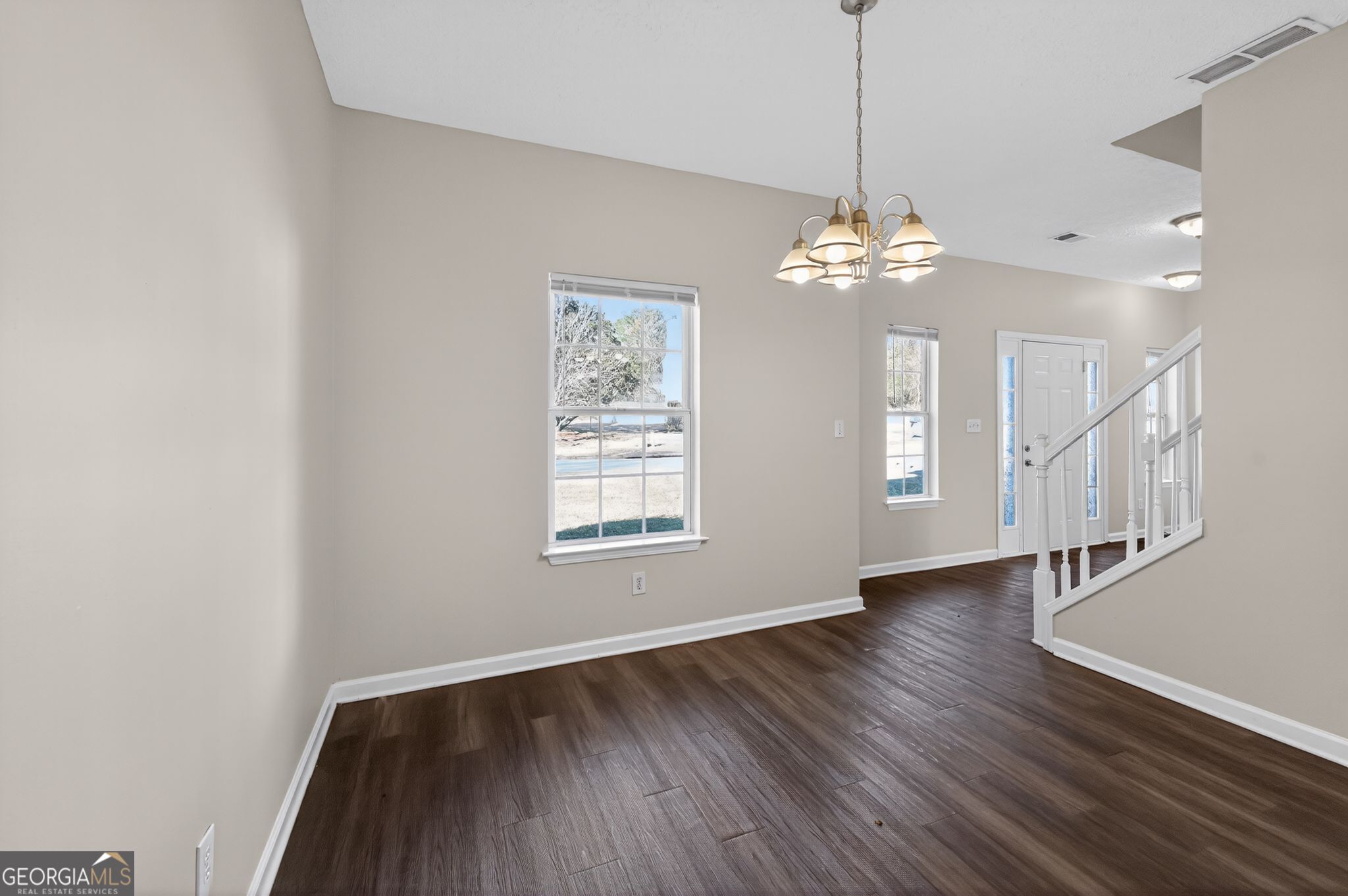 4292 Linecrest Lane Ellenwood, GA 30294 - Photo 10 of 33 a view of an empty room with wooden floor and a window