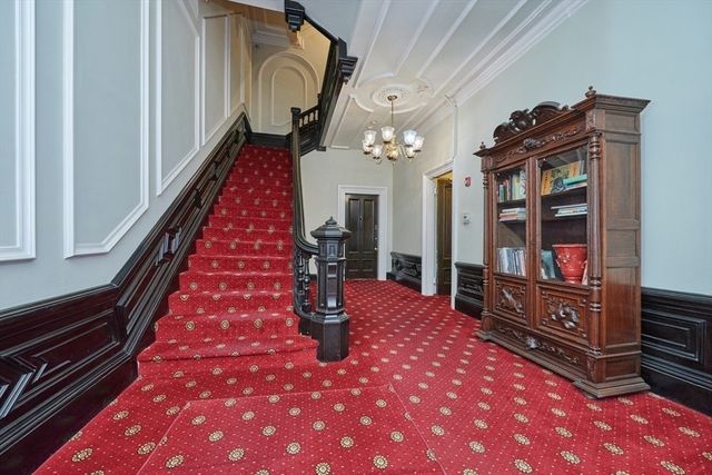 a view of a building with a tree in front