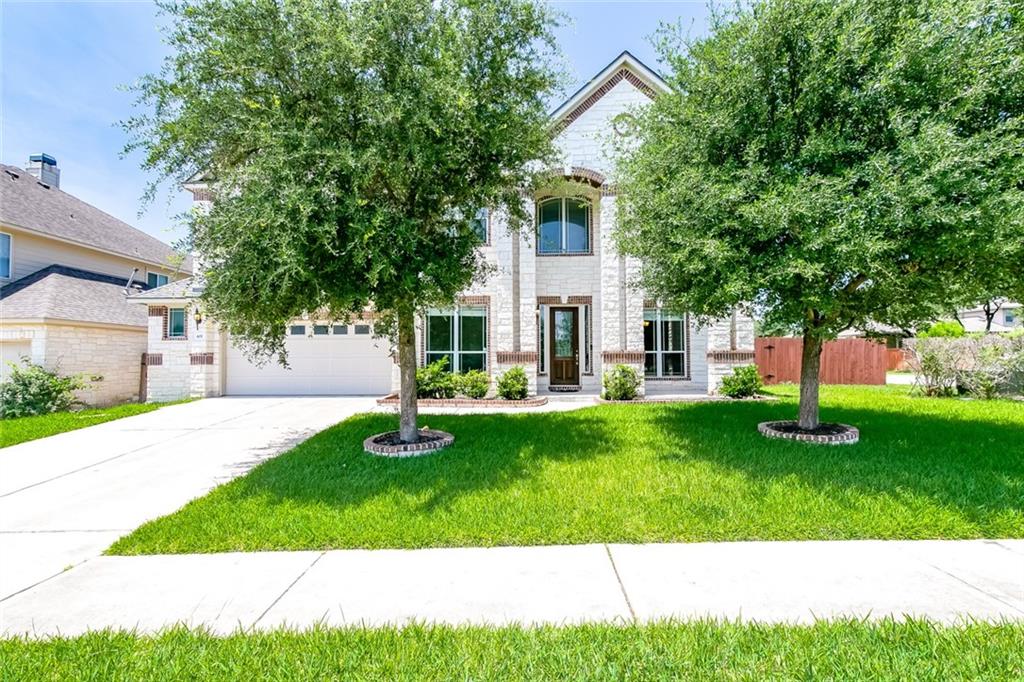 front view of a house with a yard