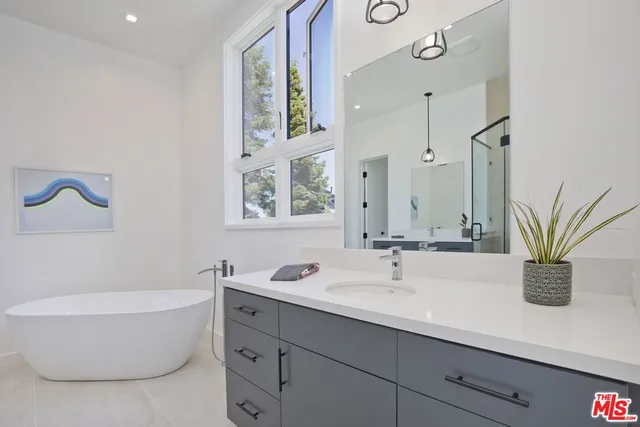 a spacious bedroom with a bed and a couch