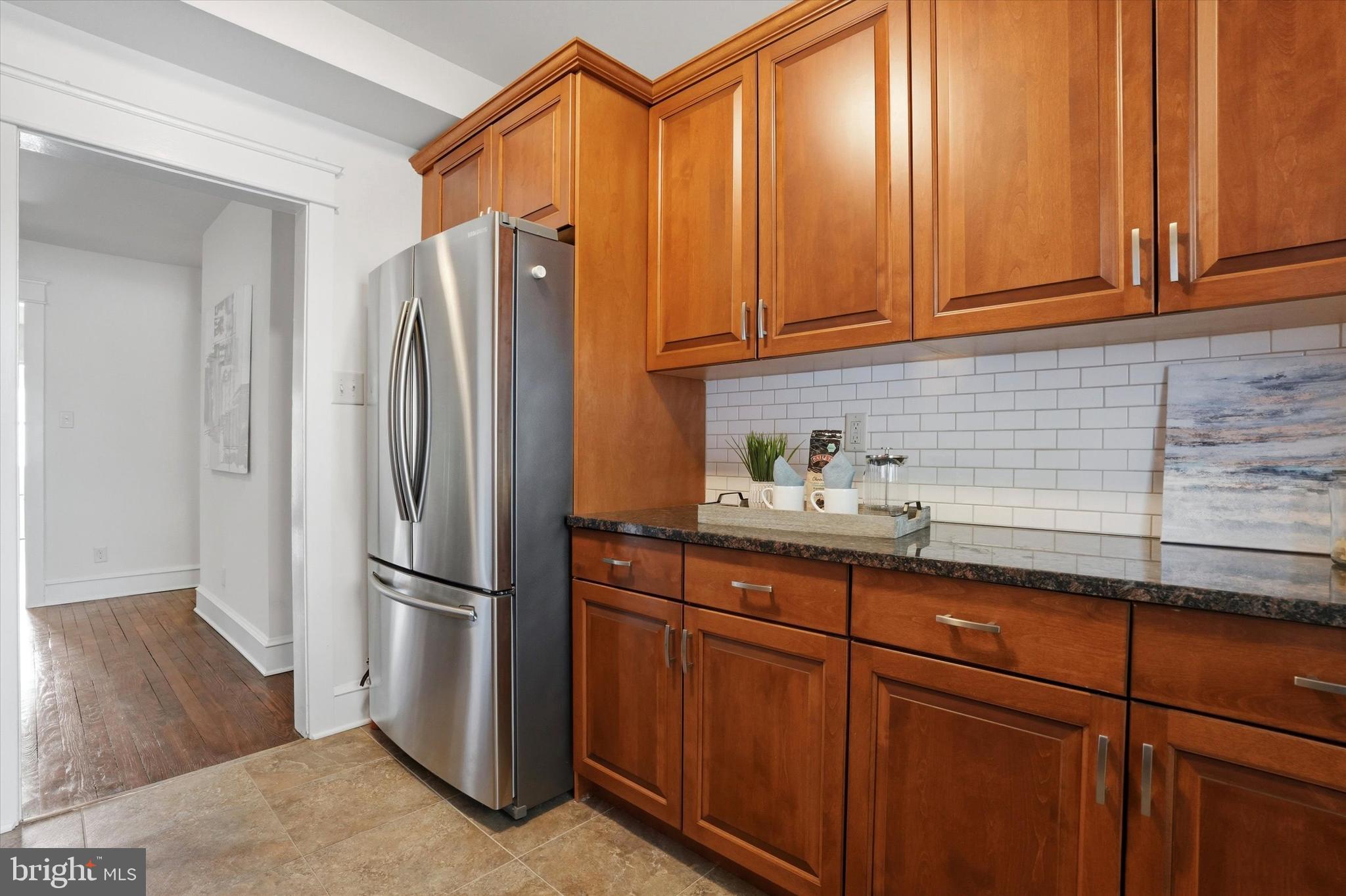 18 Vernon Road Havertown, PA 19083 - Photo 12 of 25 a kitchen with stainless steel appliances granite countertop a refrigerator and a sink