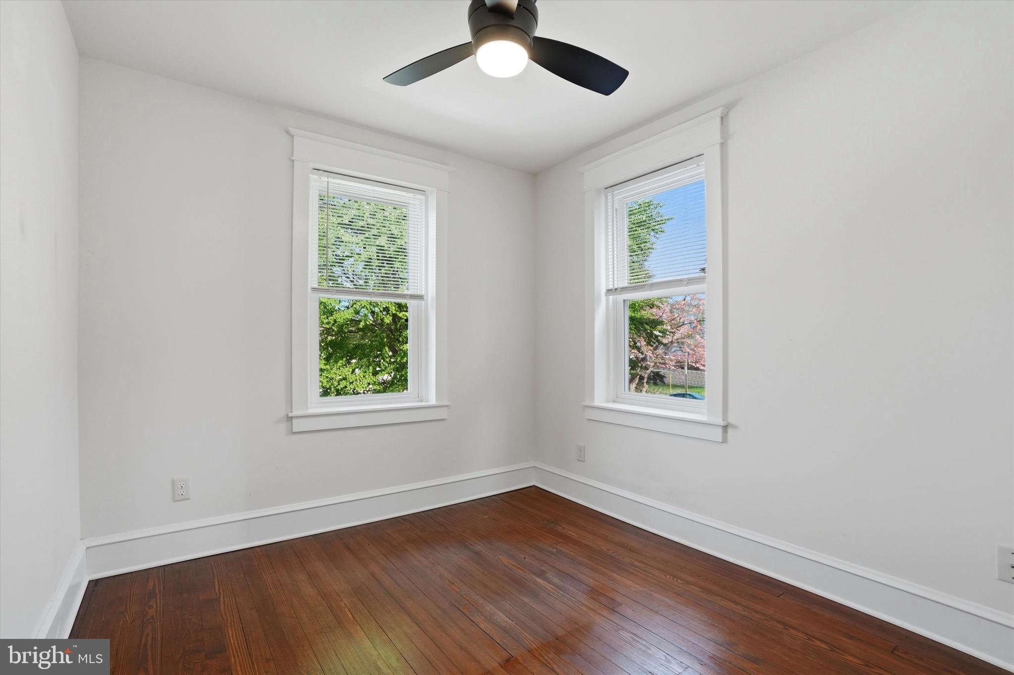 18 Vernon Road Havertown, PA 19083 - Photo 17 of 25 a view of an empty room with wooden floor and a window