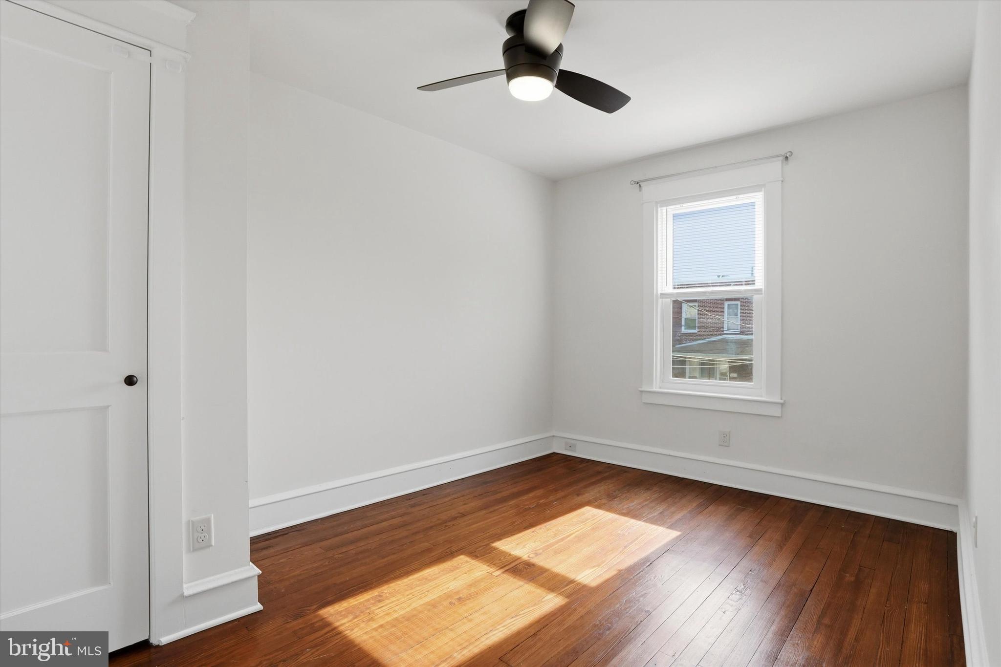 18 Vernon Road Havertown, PA 19083 - Photo 19 of 25 a view of empty room with wooden floor and fan