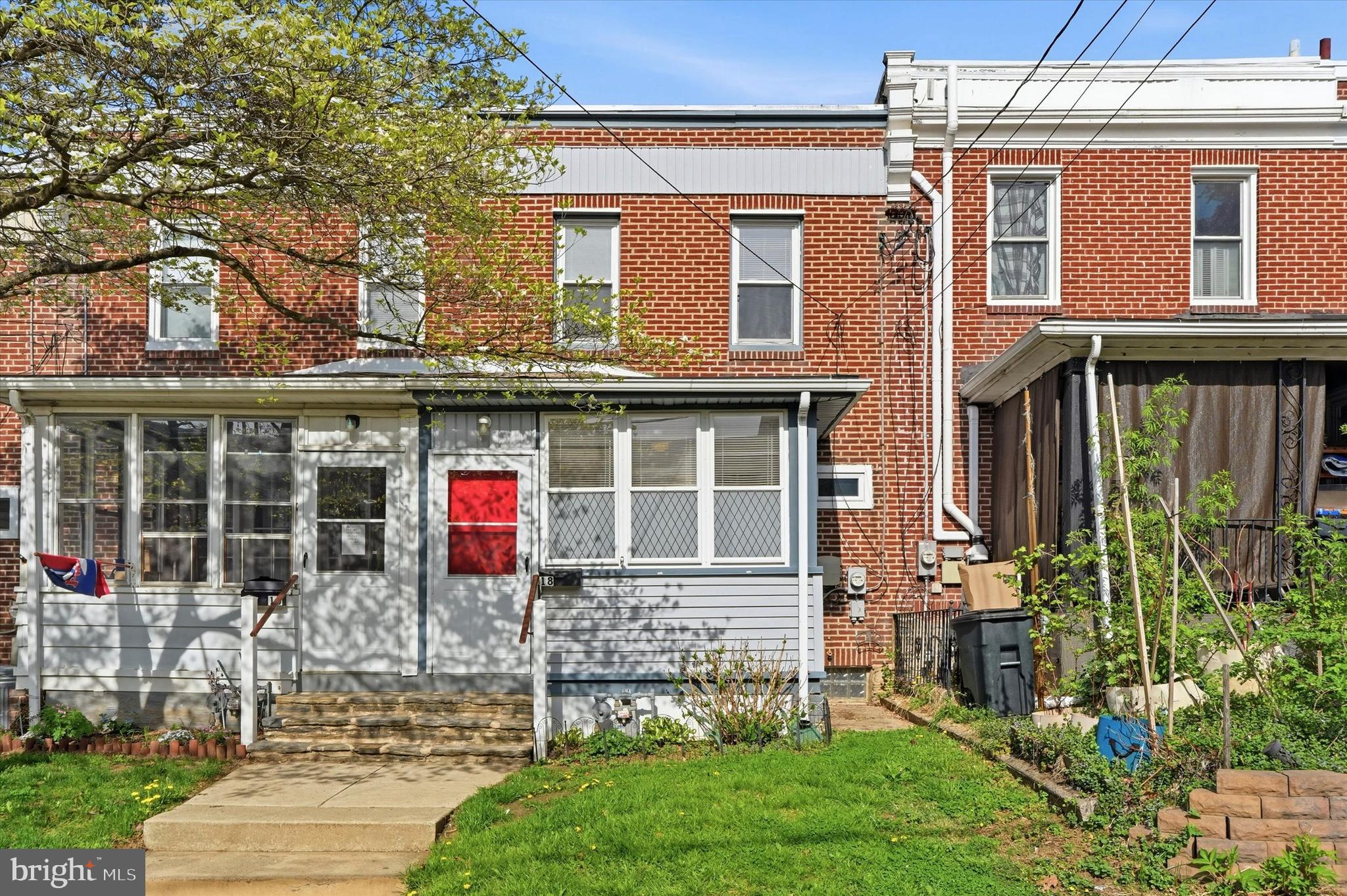 18 Vernon Road Havertown, PA 19083 - Photo 2 of 25 front view of a brick house with a yard