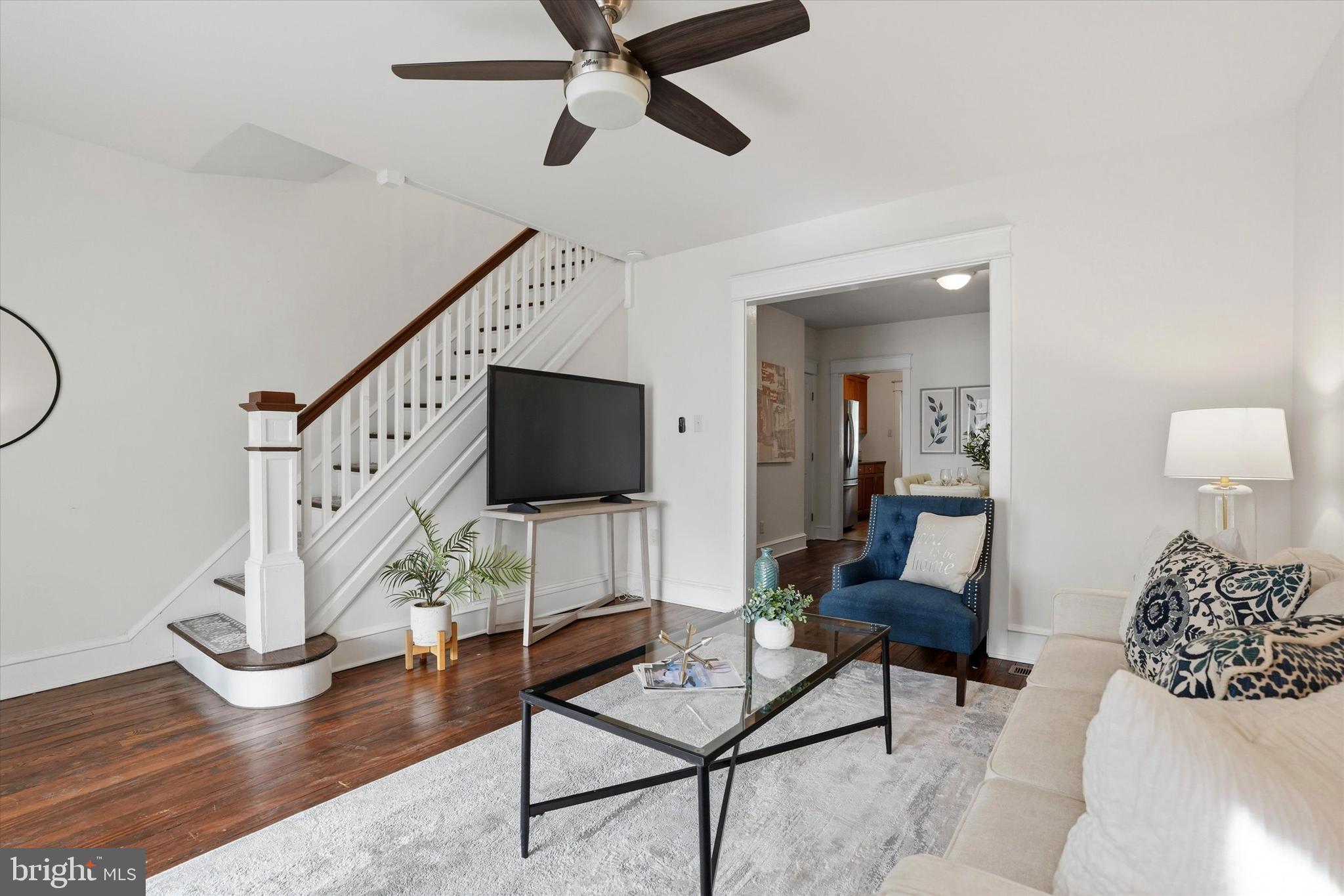 18 Vernon Road Havertown, PA 19083 - Photo 5 of 25 a living room with furniture a flat screen tv and a wooden floor