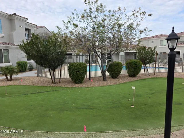 a view of a table and chairs in the garden