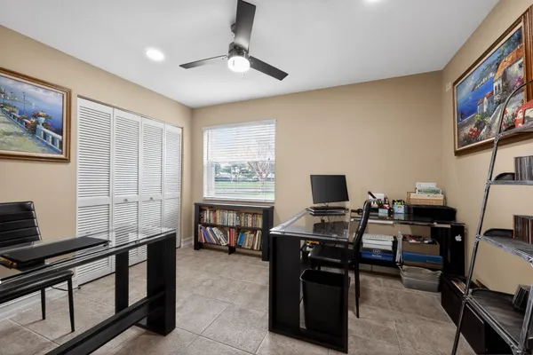 a view of living room with furniture and large windows
