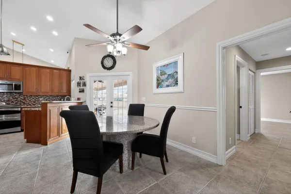 a view of a dining room with furniture window and outside view