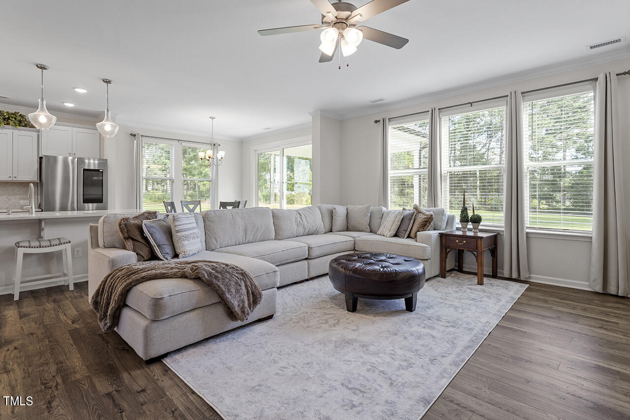 131 Hopper Circle Clayton, NC 27520 - Photo 12 of 39 a living room with furniture and a large window