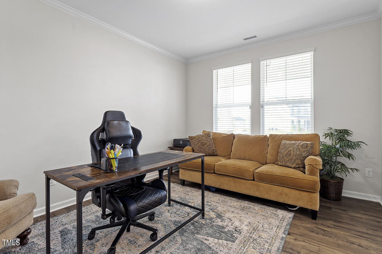 131 Hopper Circle Clayton, NC 27520 - Photo 21 of 39 a living room with furniture and a window