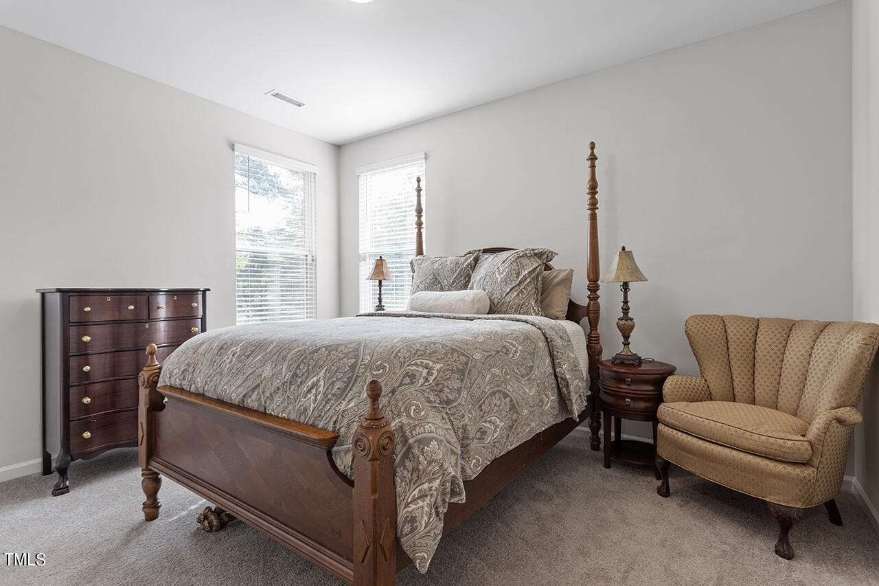 131 Hopper Circle Clayton, NC 27520 - Photo 23 of 39 a bedroom with a bed and a couch