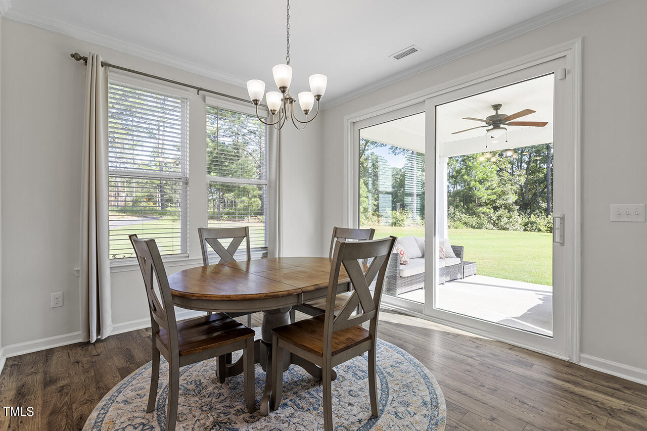 131 Hopper Circle Clayton, NC 27520 - Photo 25 of 39 a view of a dining room with furniture window and outside view