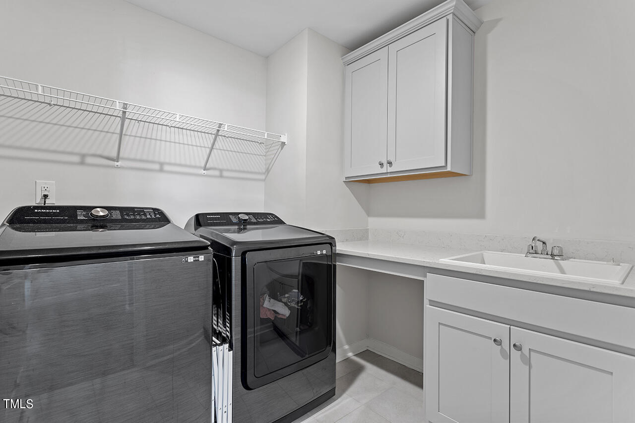131 Hopper Circle Clayton, NC 27520 - Photo 32 of 39 a utility room with sink dryer and washer