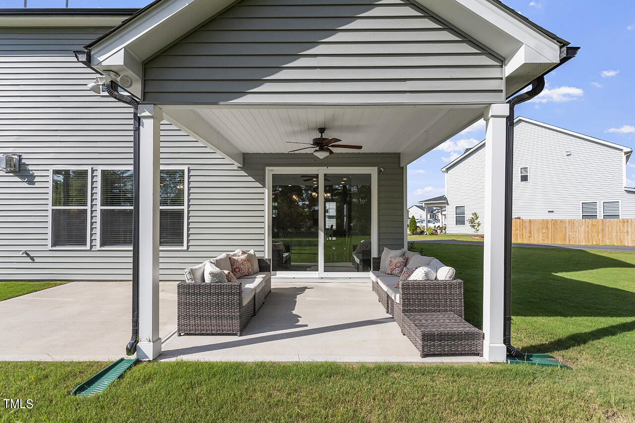 131 Hopper Circle Clayton, NC 27520 - Photo 6 of 39 a view of a patio with chairs and table in patio