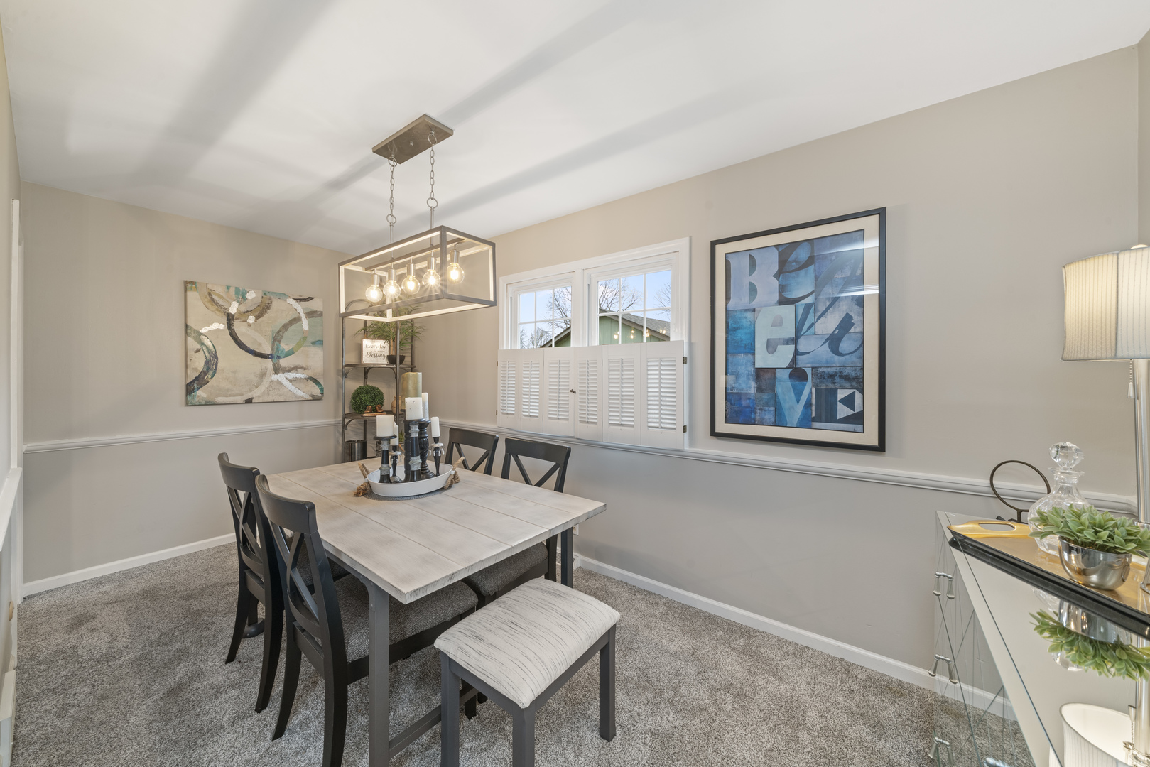 66 Winthrop New Road Sugar Grove, IL 60554 - Photo 11 of 39 a dining room with wooden floor a chandelier a wooden table and chairs
