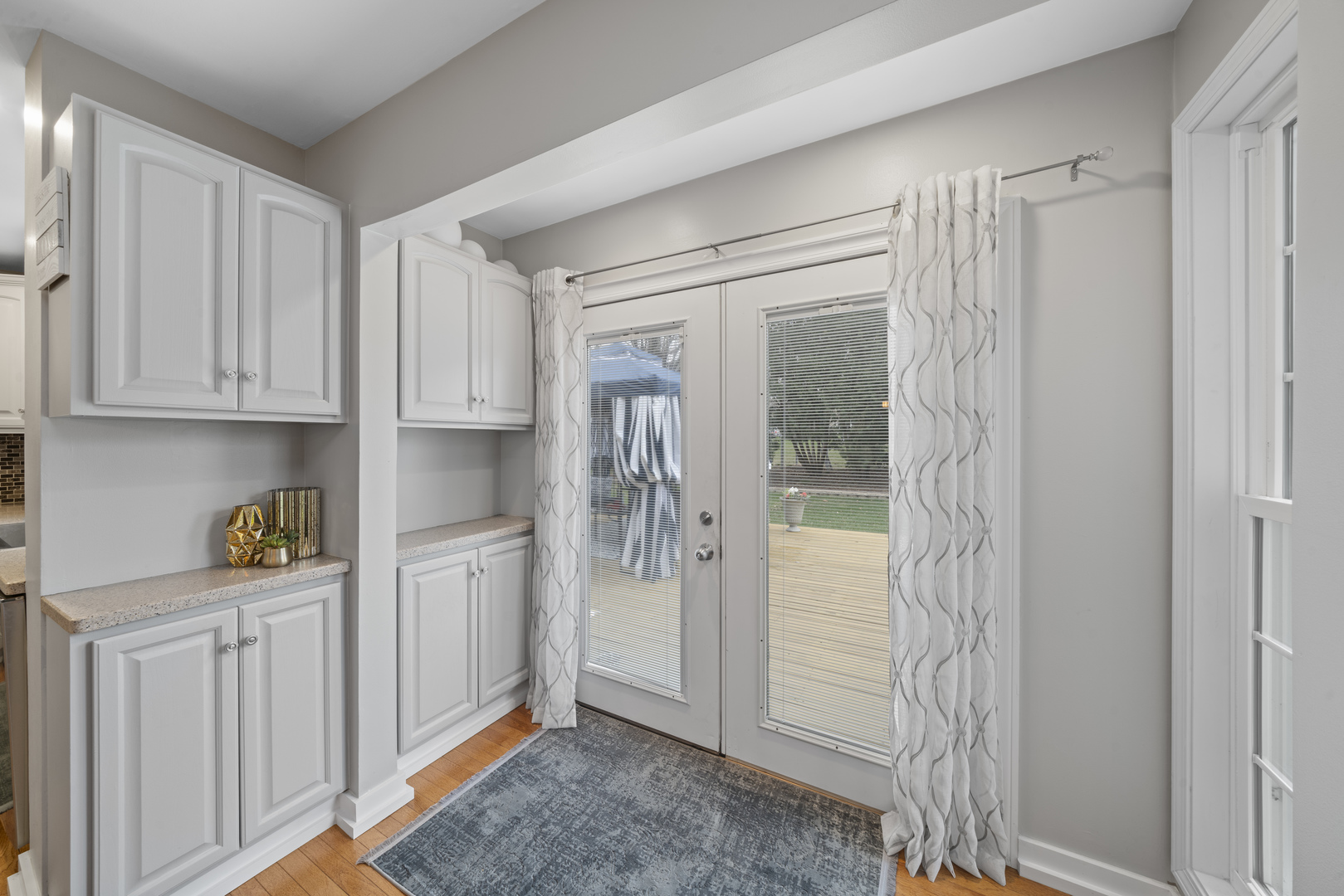 66 Winthrop New Road Sugar Grove, IL 60554 - Photo 7 of 39 a view of a kitchen with white cabinets and wooden floor