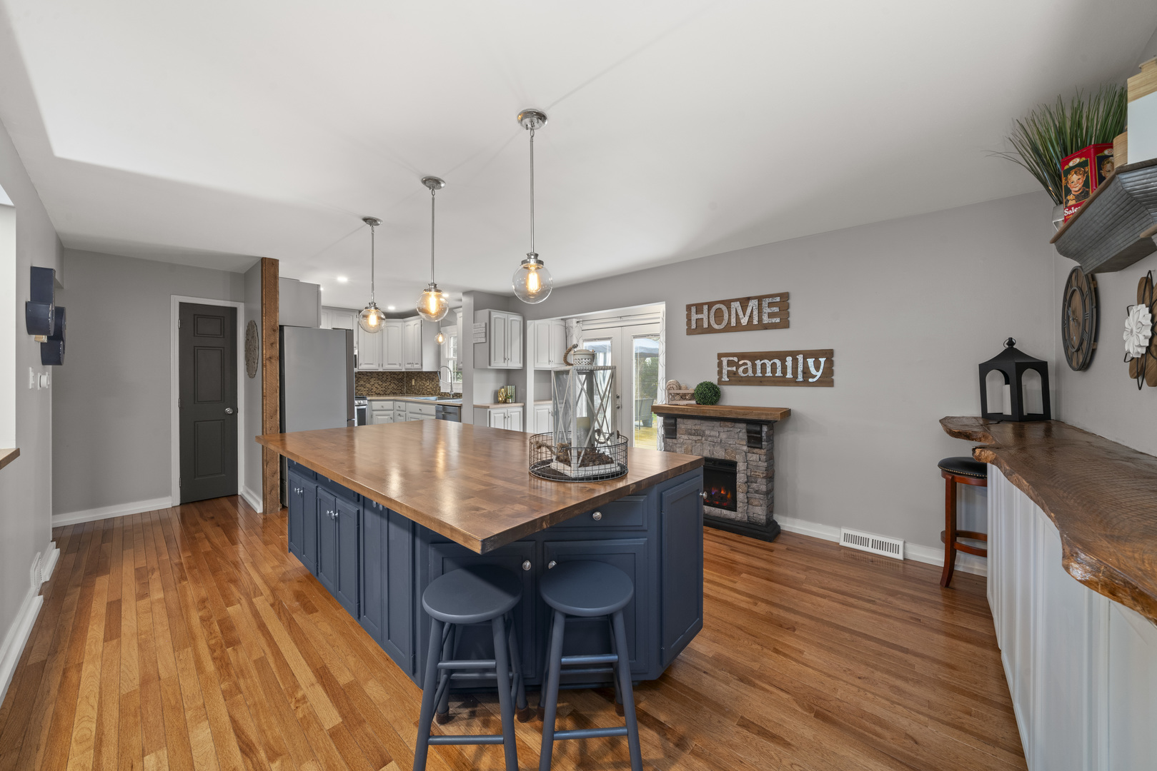 66 Winthrop New Road Sugar Grove, IL 60554 - Photo 9 of 39 a kitchen with granite countertop a table chairs stove and a wooden floor