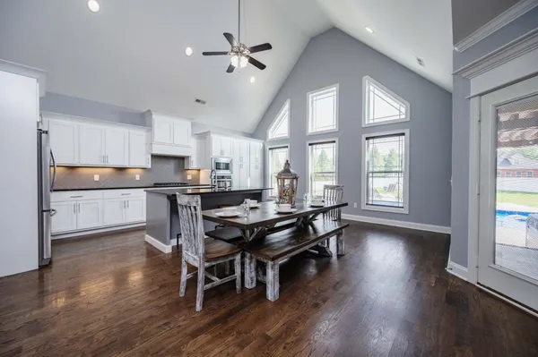 a view of a dining room with furniture and wooden floor