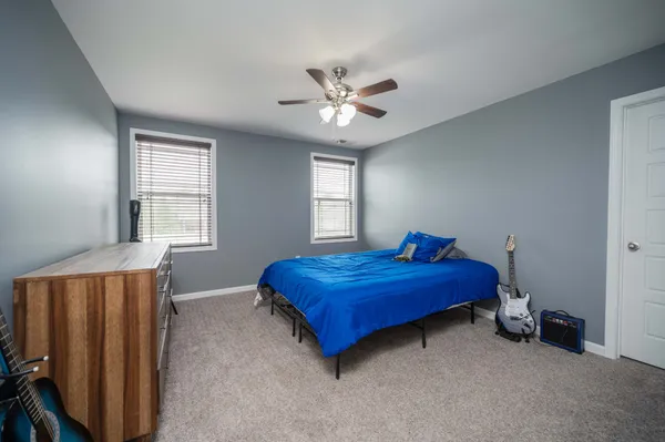 a bed room with a bed and a window