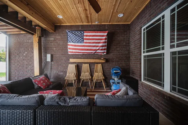 a view of a porch with furniture