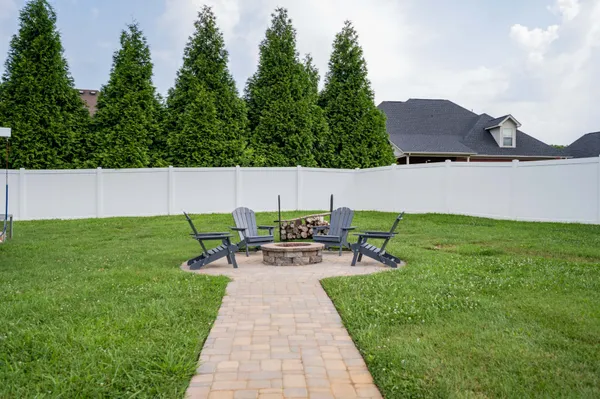 a view of a backyard with sitting area