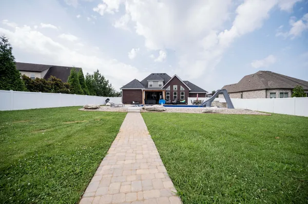 a front view of a house with garden