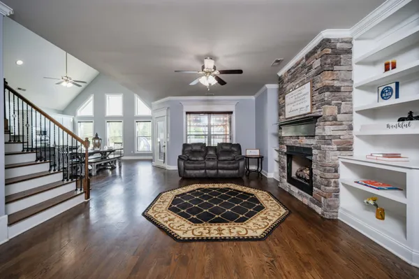 a living room with furniture and a fireplace