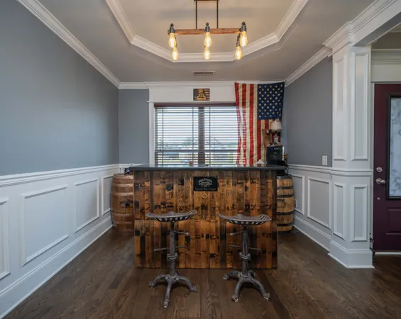 a view of a dining room with furniture and window