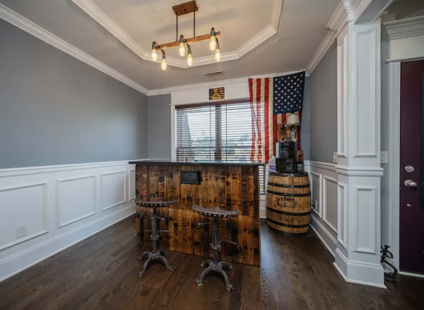 a view of a dining room with furniture and window