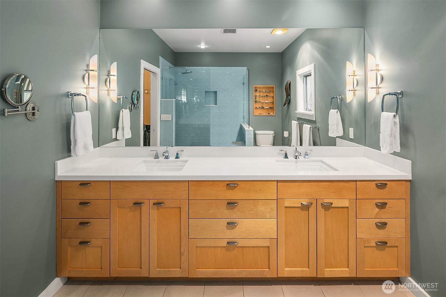 7161 Beach Drive Southwest Seattle, WA 98136 - Photo 19 of 40 a bathroom with a double vanity sink and a mirror