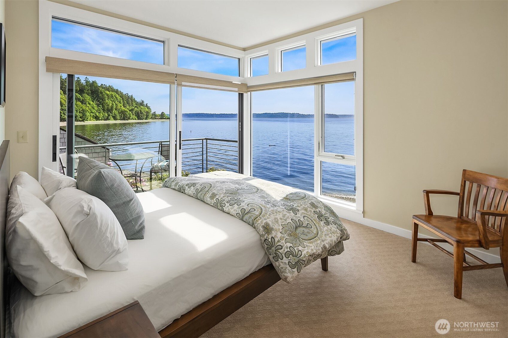 7161 Beach Drive Southwest Seattle, WA 98136 - Photo 20 of 40 a bedroom with bed and a large window
