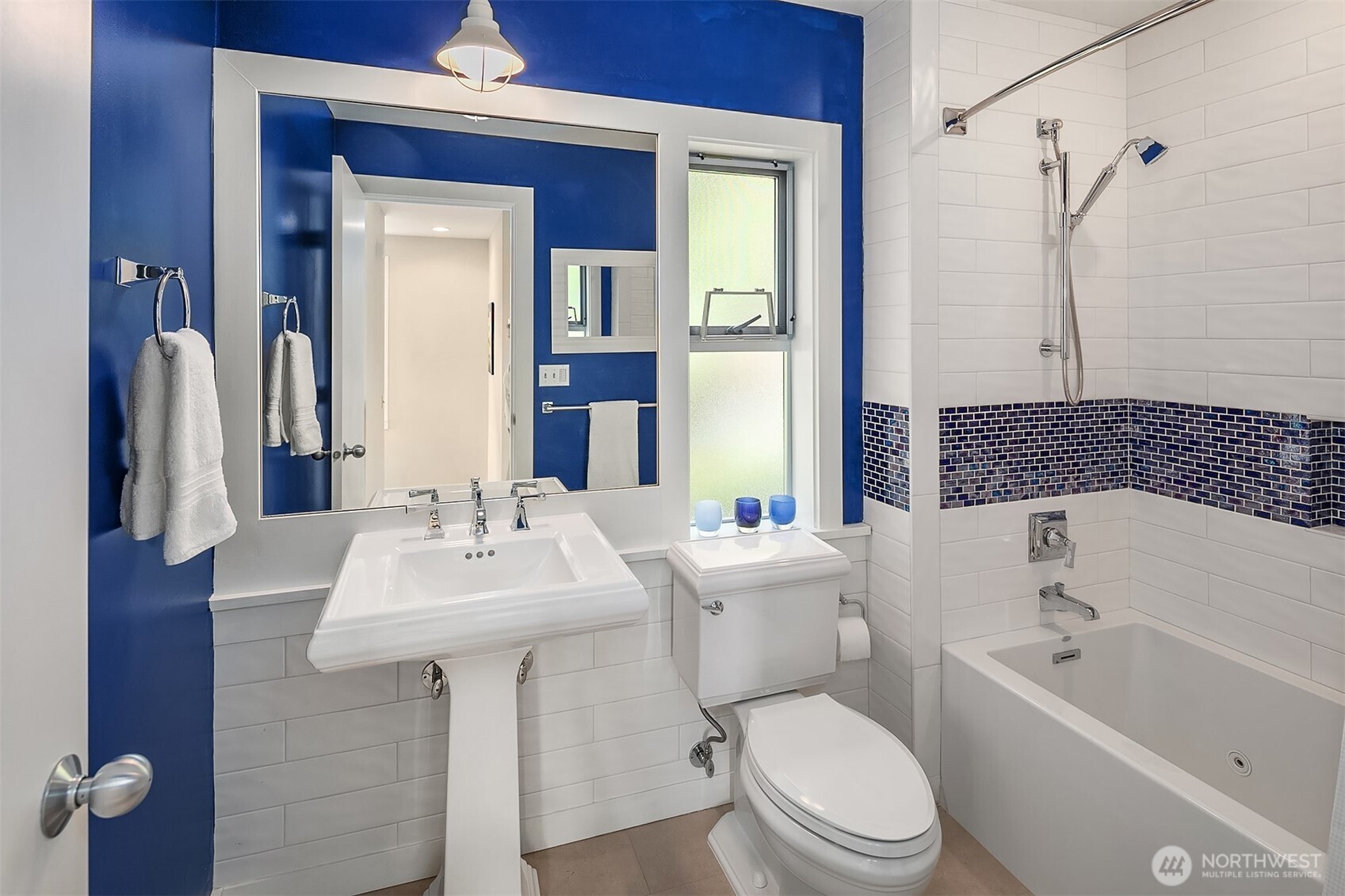 7161 Beach Drive Southwest Seattle, WA 98136 - Photo 24 of 40 a bathroom with a sink toilet and shower