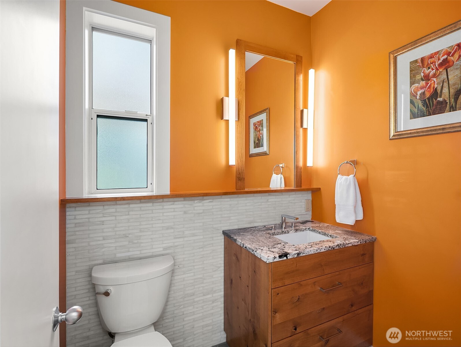 7161 Beach Drive Southwest Seattle, WA 98136 - Photo 27 of 40 a bathroom with a sink and a mirror
