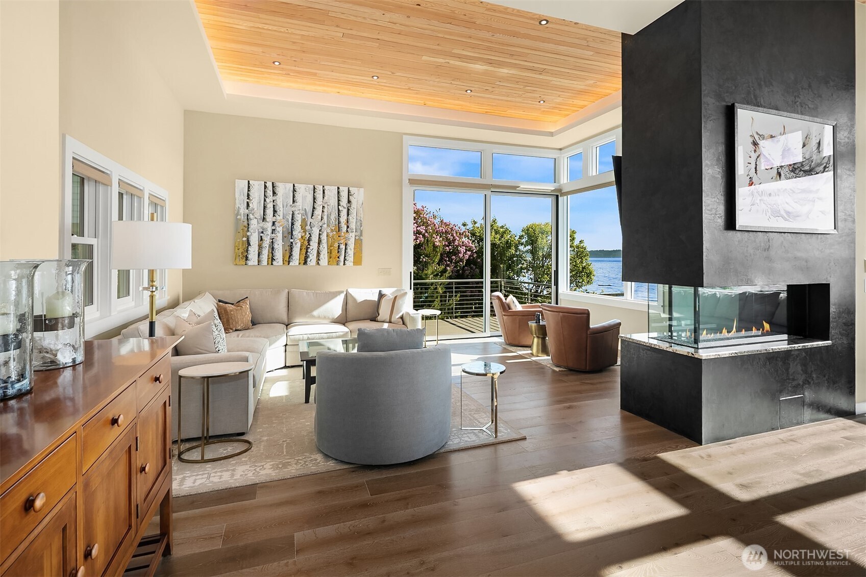 7161 Beach Drive Southwest Seattle, WA 98136 - Photo 4 of 40 a living room with furniture a large window and wooden floor