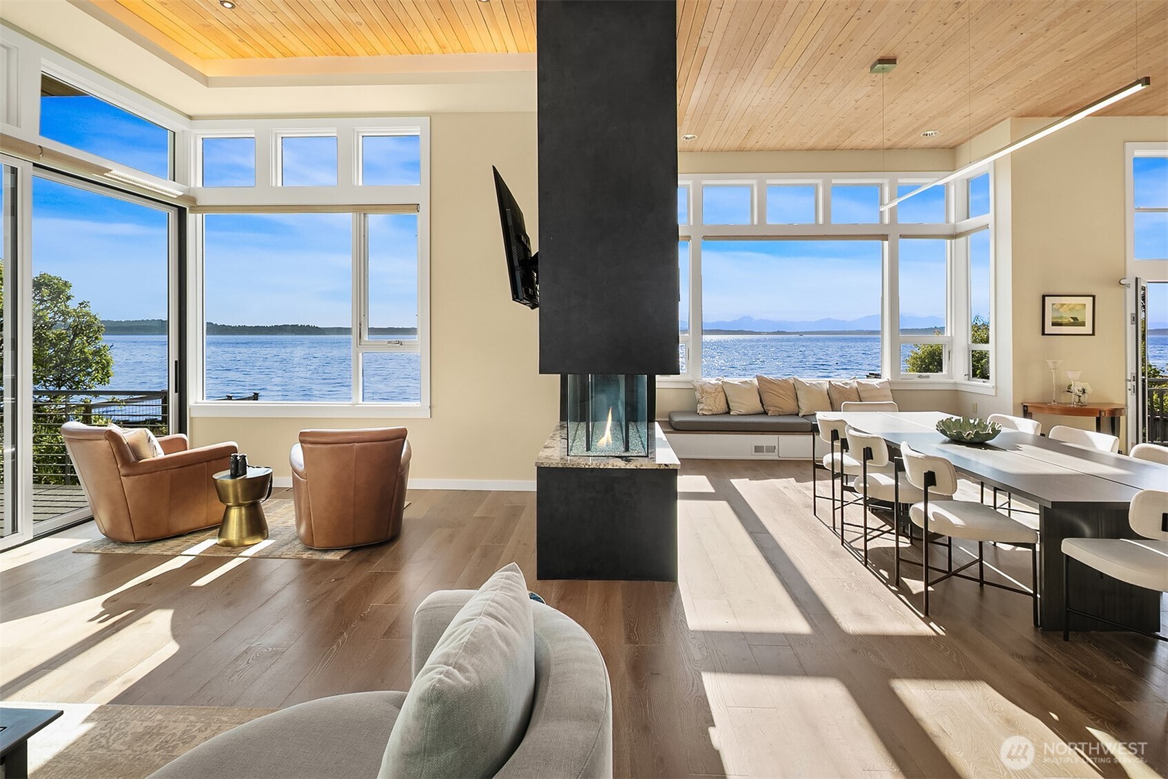 7161 Beach Drive Southwest Seattle, WA 98136 - Photo 5 of 40 a living room with furniture a large window and a table