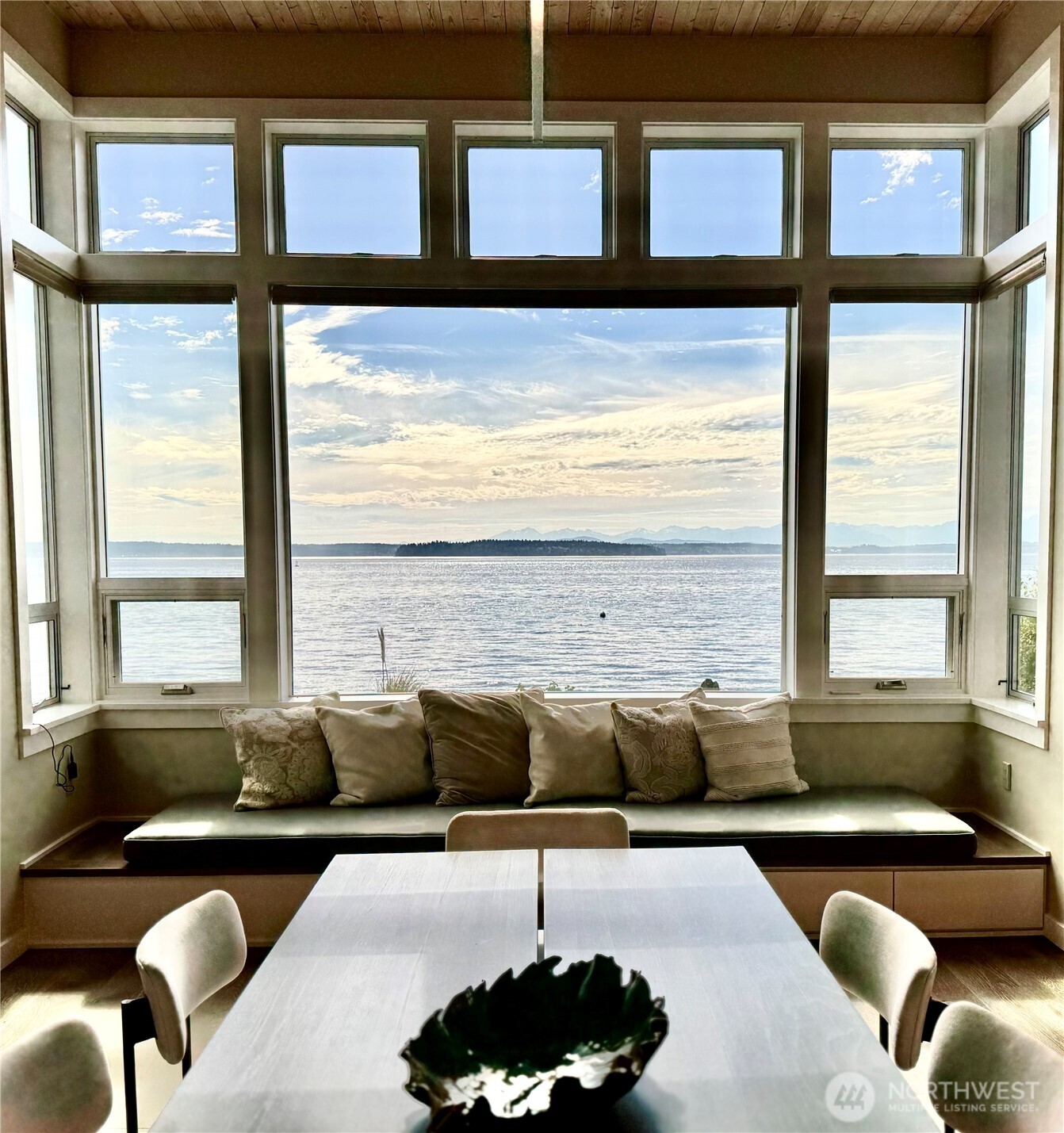 7161 Beach Drive Southwest Seattle, WA 98136 - Photo 8 of 40 a living room with furniture and floor to ceiling windows