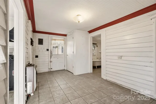 a view of a hallway with closet and entryway