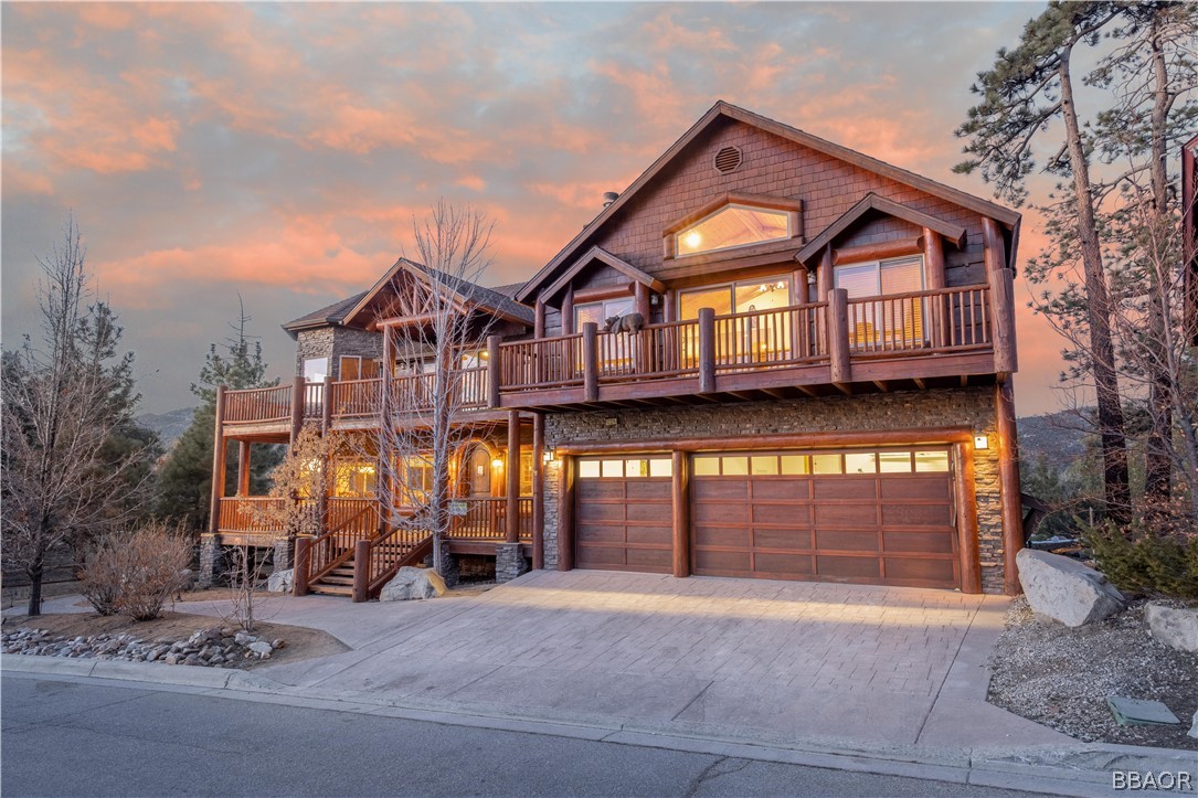 42324 Eagle Ridge Big Bear Lake, CA 92315 - Photo 1 of 50 a front view of a house with a yard and garage