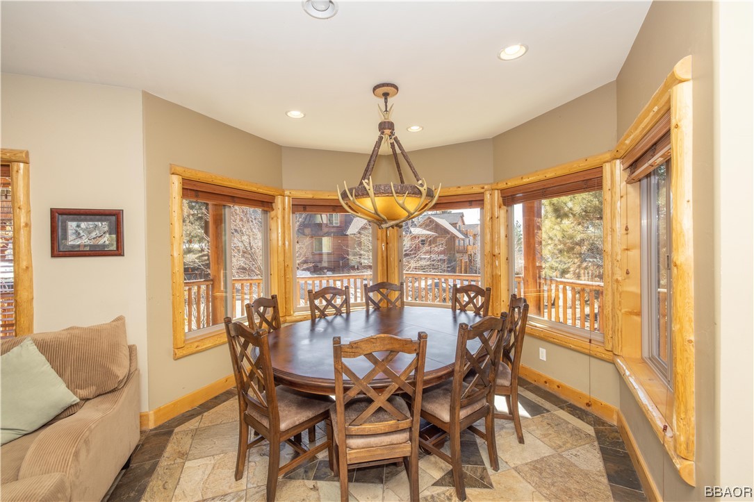 42324 Eagle Ridge Big Bear Lake, CA 92315 - Photo 12 of 50 a dining room with furniture a chandelier and wooden floor