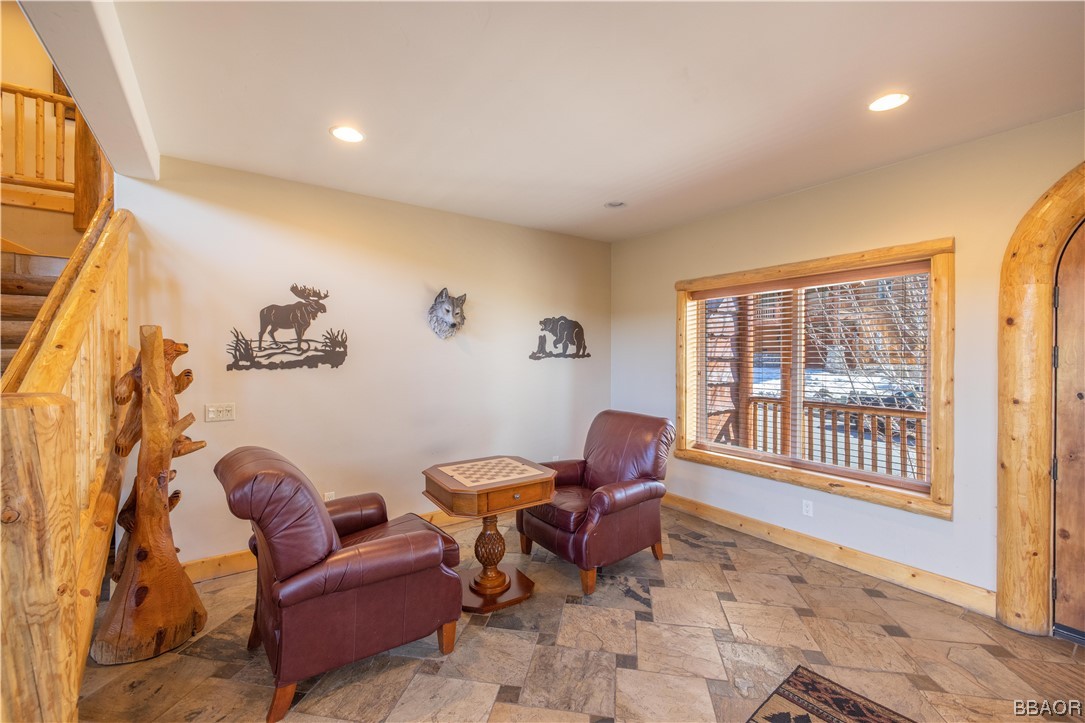 42324 Eagle Ridge Big Bear Lake, CA 92315 - Photo 14 of 50 a living room with furniture and a floor to ceiling window