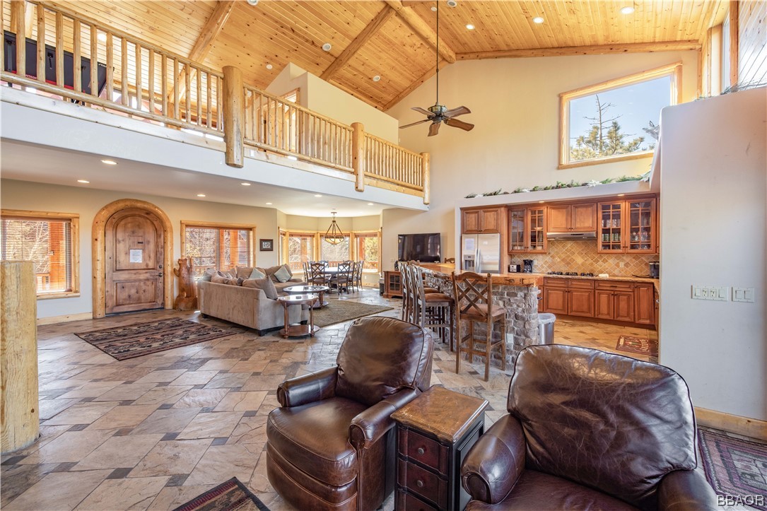 42324 Eagle Ridge Big Bear Lake, CA 92315 - Photo 16 of 50 a living room with furniture a fireplace and lots of windows