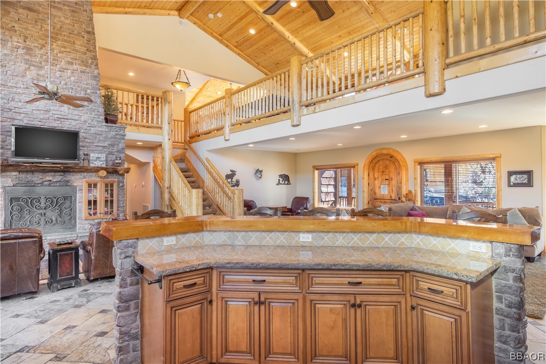 42324 Eagle Ridge Big Bear Lake, CA 92315 - Photo 21 of 50 a view of living room kitchen with granite countertop and fireplace