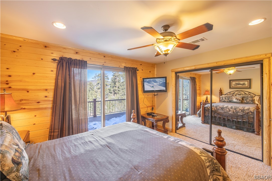42324 Eagle Ridge Big Bear Lake, CA 92315 - Photo 30 of 50 a bedroom with a bed and glass walk in closet