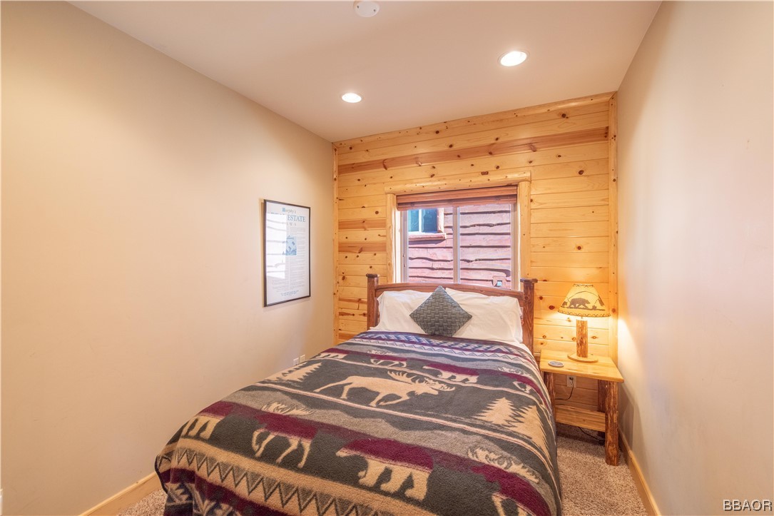 42324 Eagle Ridge Big Bear Lake, CA 92315 - Photo 32 of 50 a bedroom with a bed and a window