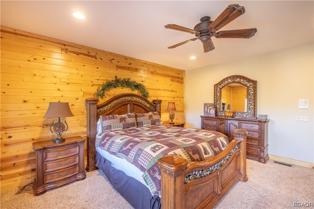 42324 Eagle Ridge Big Bear Lake, CA 92315 - Photo 36 of 50 a bedroom with a bed and a ceiling fan