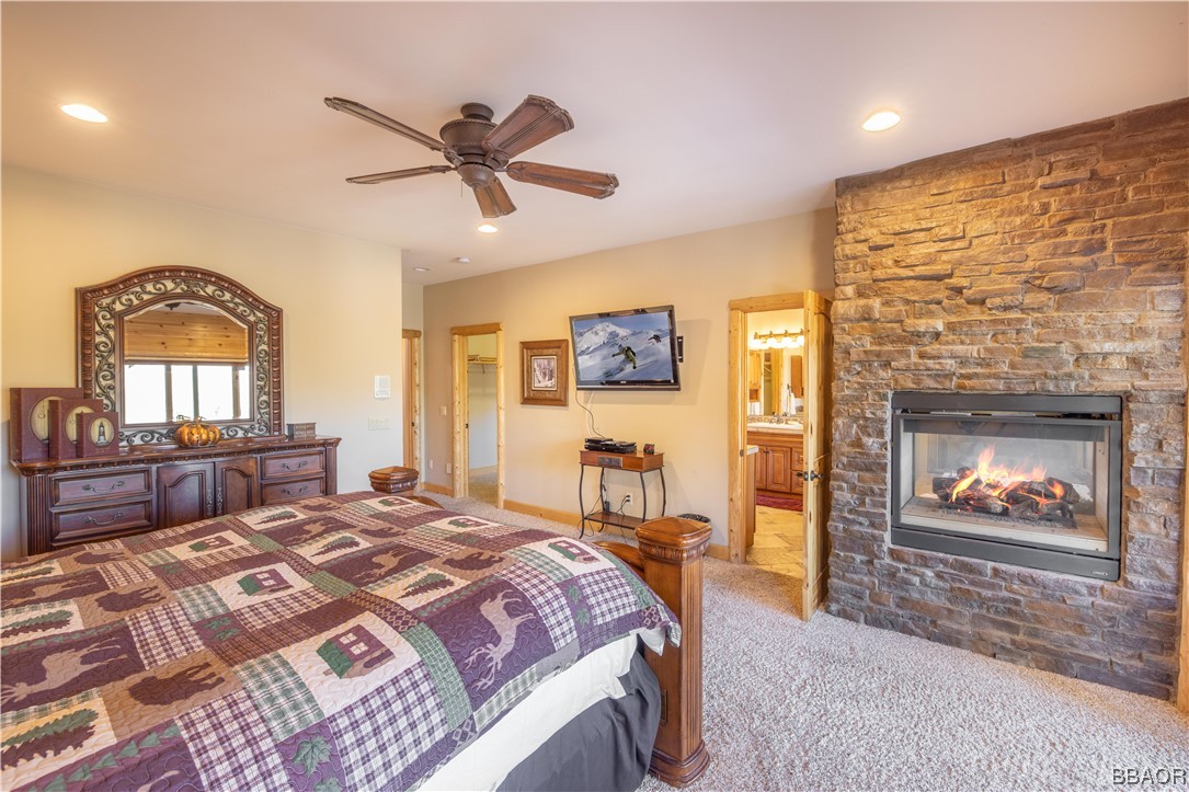 42324 Eagle Ridge Big Bear Lake, CA 92315 - Photo 37 of 50 a bedroom with a bed and a fireplace