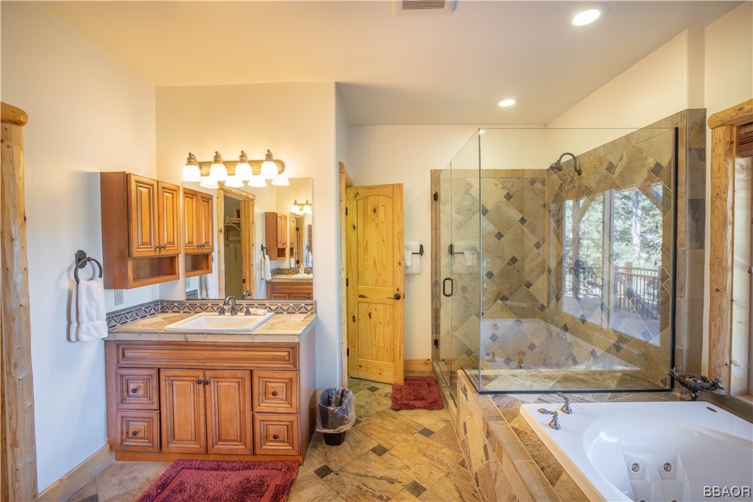 42324 Eagle Ridge Big Bear Lake, CA 92315 - Photo 39 of 50 a bathroom with shower bathtub and sink