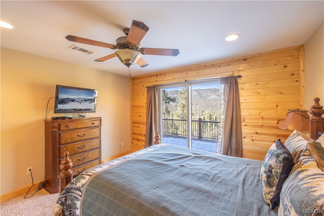 42324 Eagle Ridge Big Bear Lake, CA 92315 - Photo 44 of 50 a bedroom with a bed and a chandelier