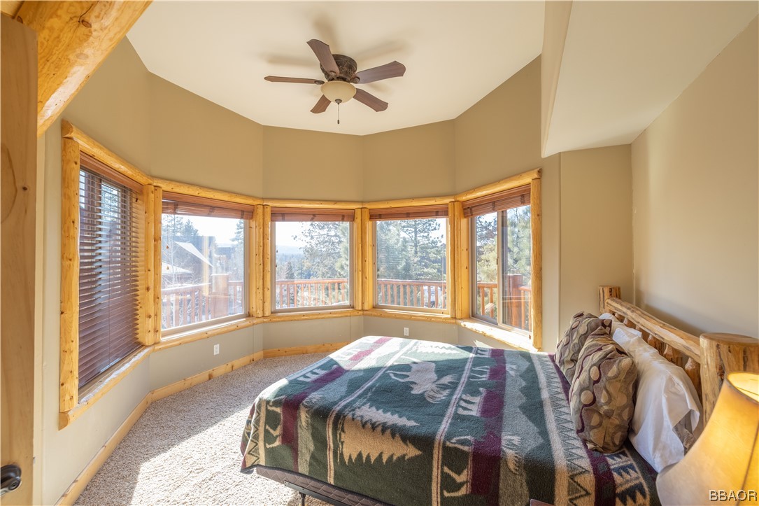42324 Eagle Ridge Big Bear Lake, CA 92315 - Photo 46 of 50 a spacious bedroom with a bed and a large window